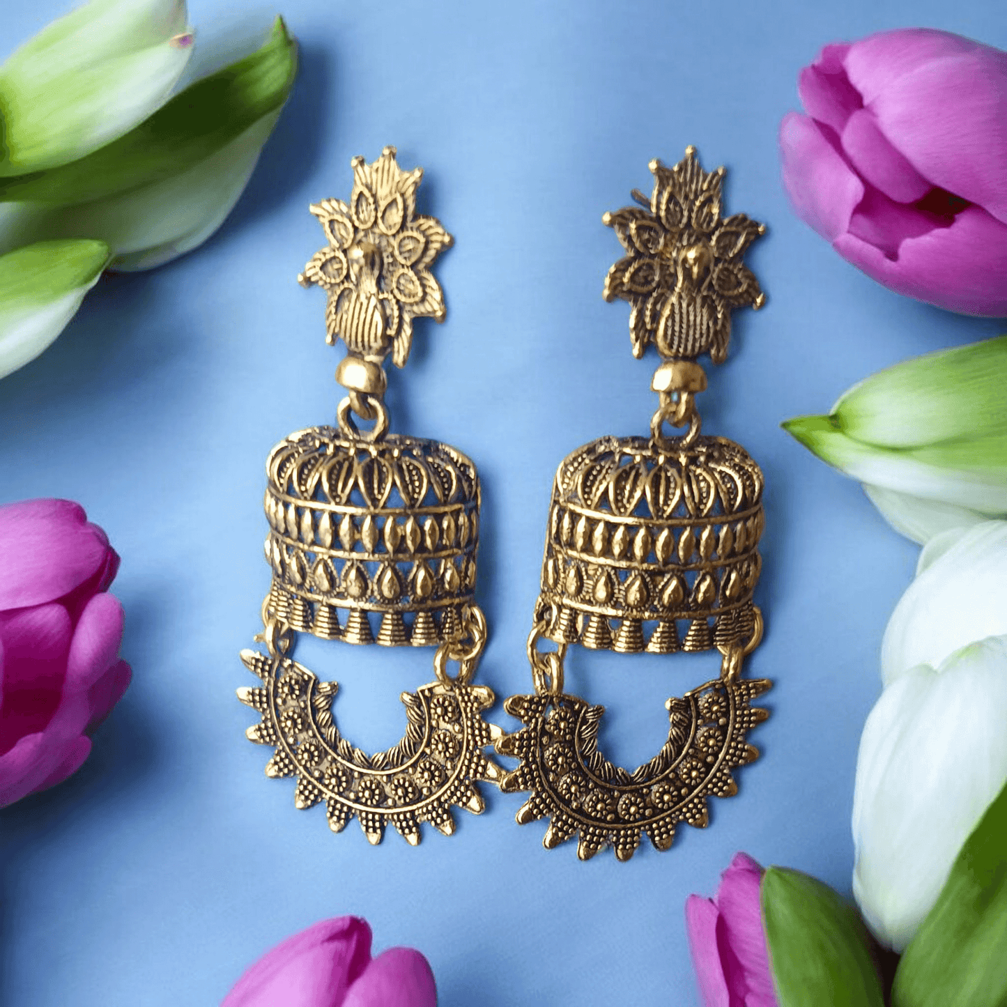 Antique gold-toned temple earrings with intricate floral and cylindrical design