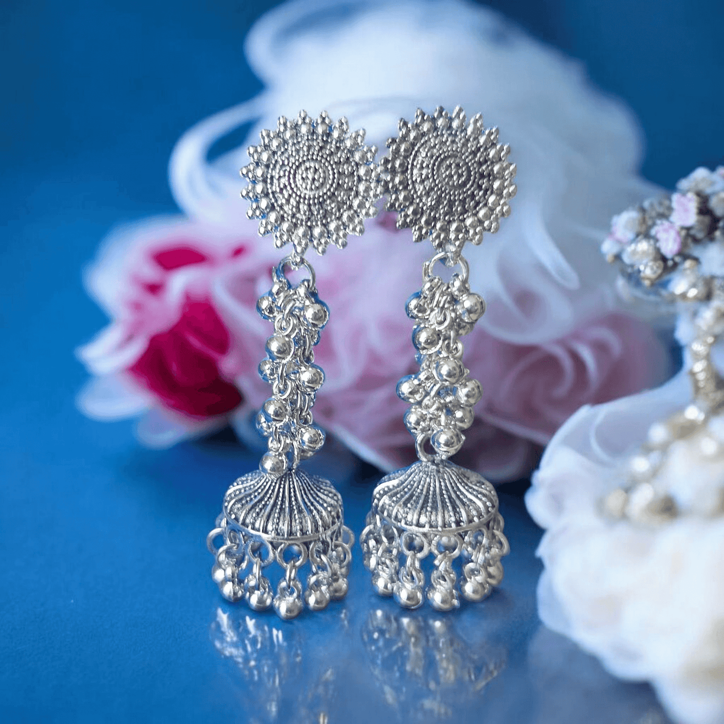 Side angle showing layered oxidized jhumka structure and beadwork