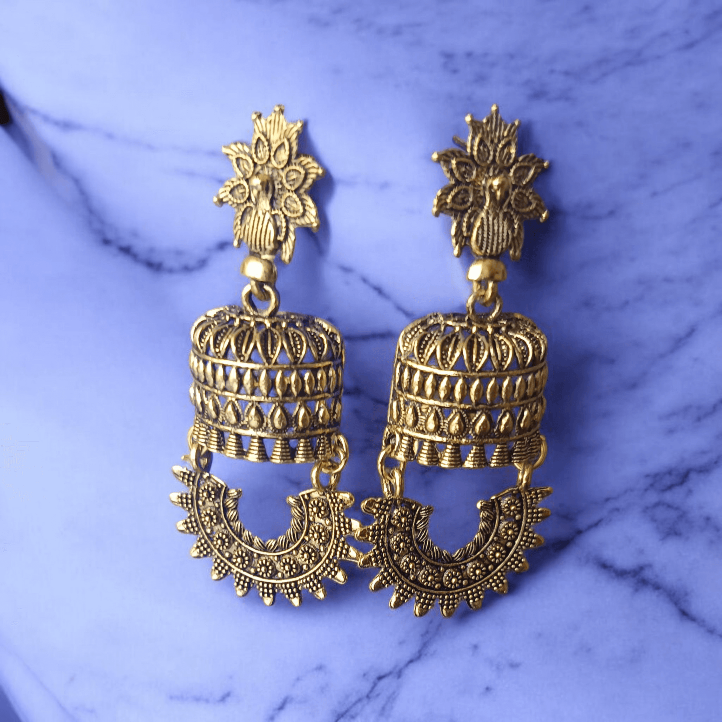 Antique gold-toned temple earrings with intricate floral and cylindrical design